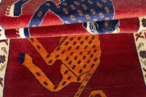 Full view of 2000s Persian Gabbeh rug from Iran / Persia, 235 × 102 cm in Red tones