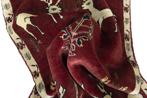 Corner detail of 2000s Persian Gabbeh rug showing border pattern and Wool pile
