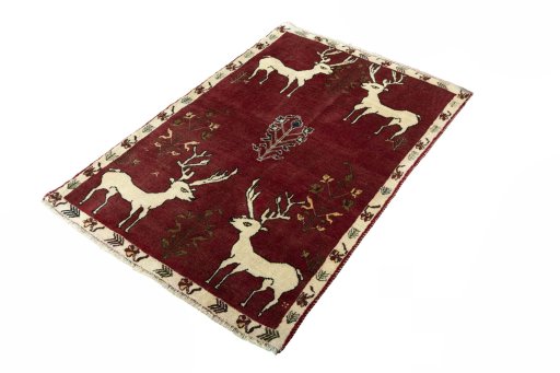 Corner detail of 2000s Persian Gabbeh rug showing border pattern and Wool pile