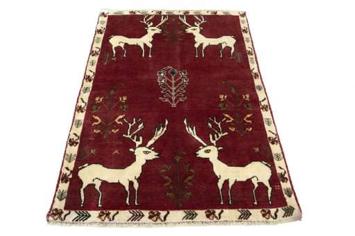 Surface texture of 2000s Persian Gabbeh rug with natural Wool and intricate pattern