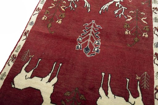 Backside of handmade 2000s Persian Gabbeh rug showing knot structure and weave density