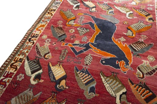 Backside of handmade 2000s Persian Gabbeh rug showing knot structure and weave density