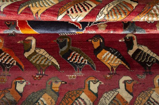 Full view of 2000s Persian Gabbeh rug from Iran / Persia, 215 × 143 cm in Red tones