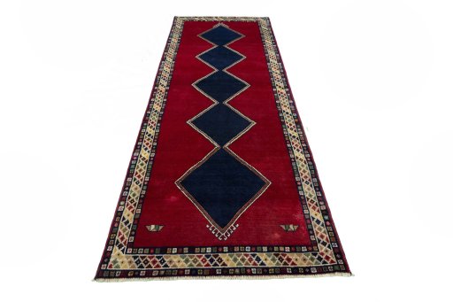 Surface texture of 2000s Persian Gabbeh rug with natural Wool and intricate pattern