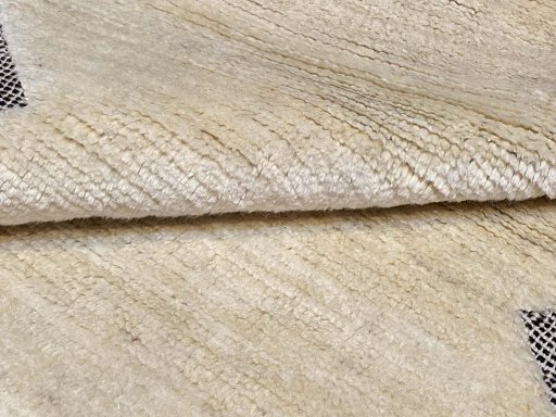 Surface texture of New Persian Gabbeh rug with natural Wool and intricate pattern