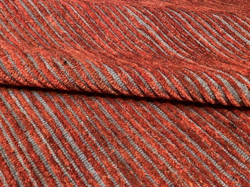 Backside of handmade New Persian Gabbeh rug showing knot structure and weave density