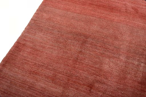 Backside of handmade 2000s Persian Gabbeh rug showing knot structure and weave density