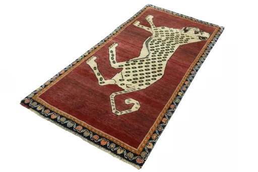 Corner detail of 2000s Persian Gabbeh rug showing border pattern and Wool pile