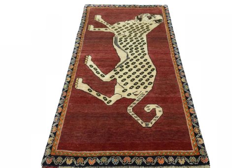 Surface texture of 2000s Persian Gabbeh rug with natural Wool and intricate pattern