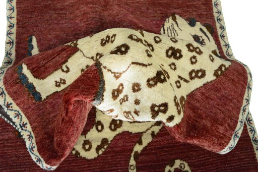 Corner detail of 2000s Persian Gabbeh rug showing border pattern and Wool pile