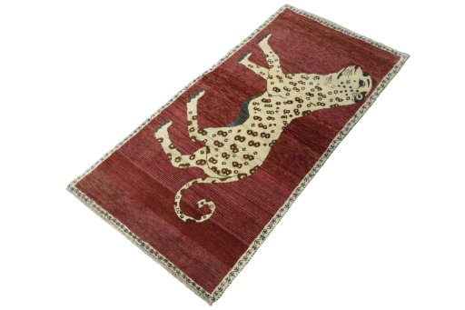 Corner detail of 2000s Persian Gabbeh rug showing border pattern and Wool pile