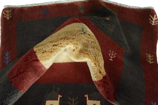 Corner detail of New Persian Gabbeh rug showing border pattern and Wool pile
