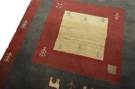 Backside of handmade New Persian Gabbeh rug showing knot structure and weave density