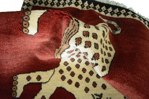 Corner detail of 2000s Persian Gabbeh rug showing border pattern and Wool pile