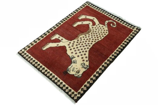 Corner detail of 2000s Persian Gabbeh rug showing border pattern and Wool pile
