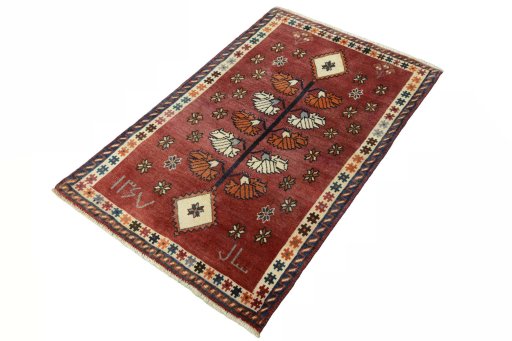 Corner detail of 2000s Persian Gabbeh rug showing border pattern and Wool pile