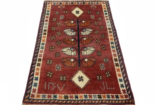 Surface texture of 2000s Persian Gabbeh rug with natural Wool and intricate pattern