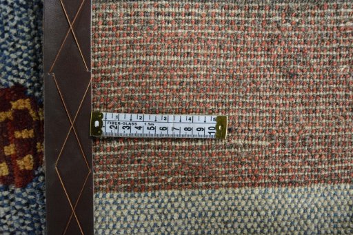 Corner detail of 2000s Persian Gabbeh rug showing border pattern and Wool pile
