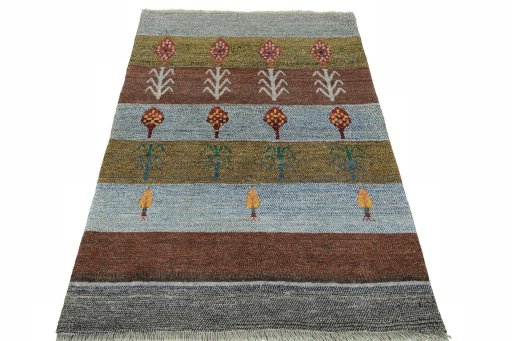 Surface texture of 2000s Persian Gabbeh rug with natural Wool and intricate pattern