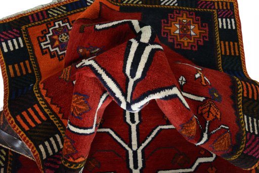 Corner detail of 2000s Persian Gabbeh rug showing border pattern and Wool pile