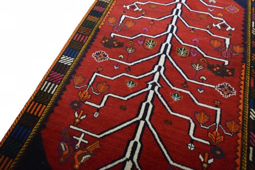 Backside of handmade 2000s Persian Gabbeh rug showing knot structure and weave density