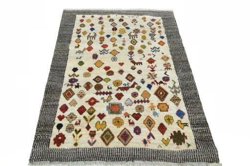 Surface texture of 2000s Persian Gabbeh rug with natural Wool and intricate pattern