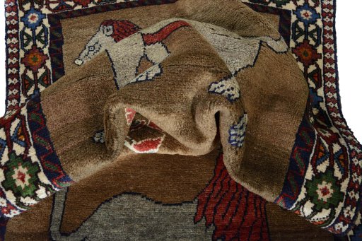 Corner detail of 2000s Persian Gabbeh rug showing border pattern and Wool pile