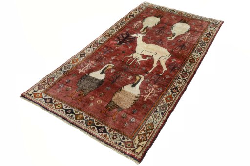 Corner detail of 2000s Persian Gabbeh rug showing border pattern and Wool pile
