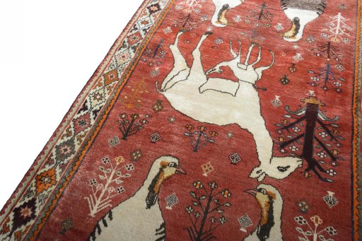 Backside of handmade 2000s Persian Gabbeh rug showing knot structure and weave density