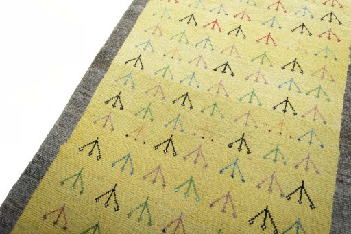 Backside of handmade 2000s Persian Gabbeh rug showing knot structure and weave density