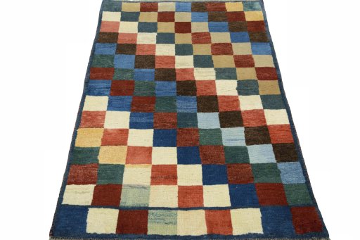 Surface texture of 2000s Persian Gabbeh rug with natural Wool and intricate pattern