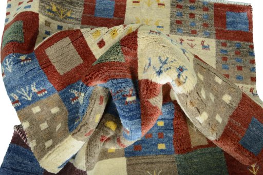 Corner detail of New Persian Gabbeh rug showing border pattern and Wool pile