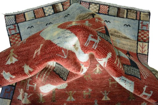 Corner detail of 2000s Persian Gabbeh rug showing border pattern and Wool pile