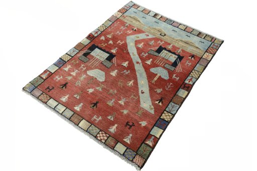 Corner detail of 2000s Persian Gabbeh rug showing border pattern and Wool pile