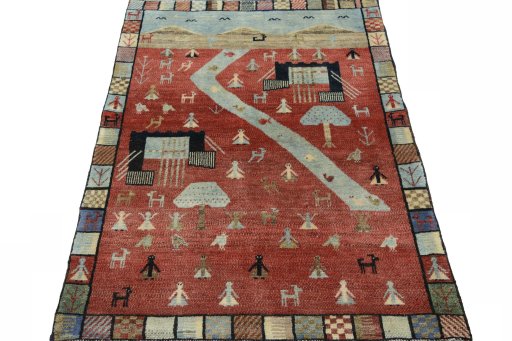 Surface texture of 2000s Persian Gabbeh rug with natural Wool and intricate pattern