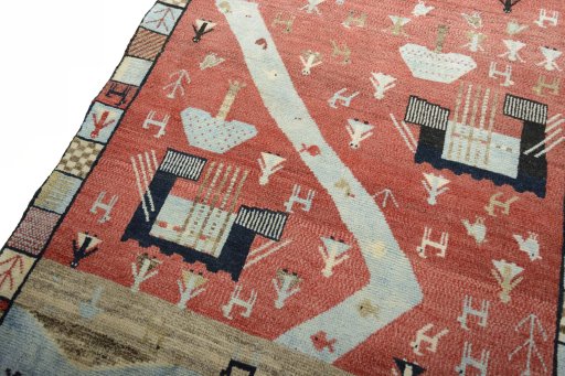 Backside of handmade 2000s Persian Gabbeh rug showing knot structure and weave density