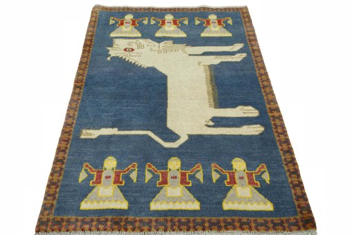 Surface texture of 2000s Persian Gabbeh rug with natural Wool and intricate pattern