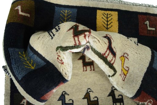Corner detail of New Persian Gabbeh rug showing border pattern and Wool pile