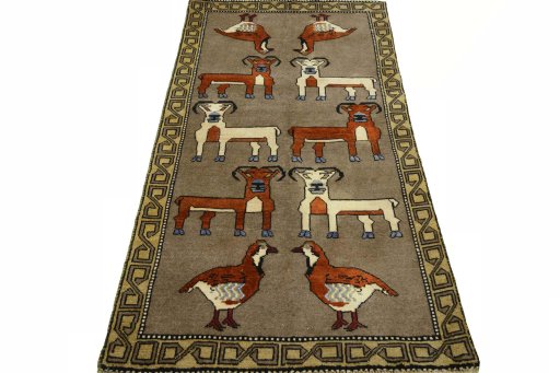 Surface texture of 2000s Persian Gabbeh rug with natural Wool and intricate pattern