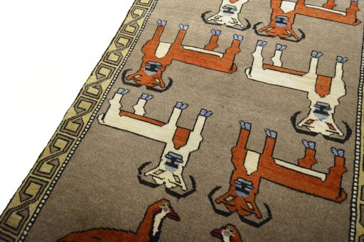 Backside of handmade 2000s Persian Gabbeh rug showing knot structure and weave density