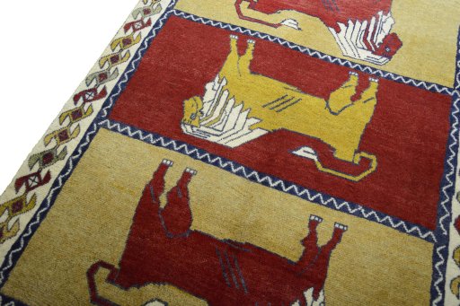 Backside of handmade 2000s Persian Gabbeh rug showing knot structure and weave density