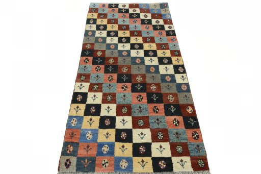 Surface texture of 2000s Persian Gabbeh rug with natural Wool and intricate pattern