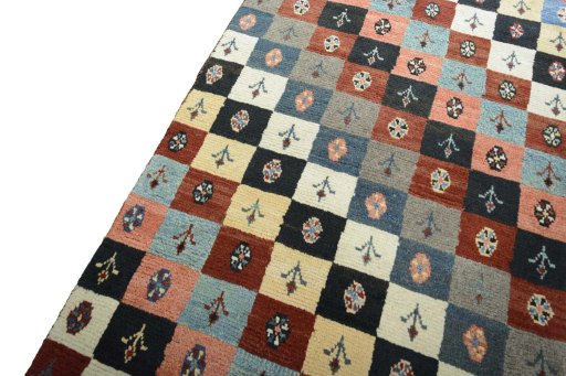 Backside of handmade 2000s Persian Gabbeh rug showing knot structure and weave density