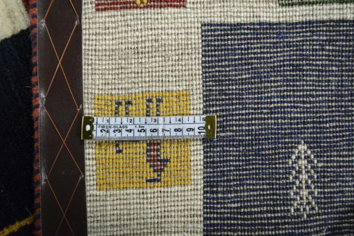 Corner detail of New Persian Gabbeh rug showing border pattern and Wool pile