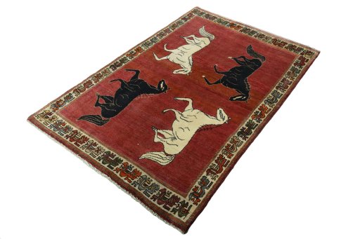 Corner detail of 2000s Persian Gabbeh rug showing border pattern and Wool pile