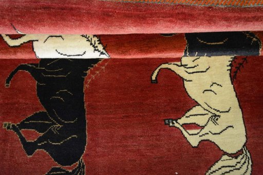 Full view of 2000s Persian Gabbeh rug from Iran / Persia, 198 × 135 cm in Red tones