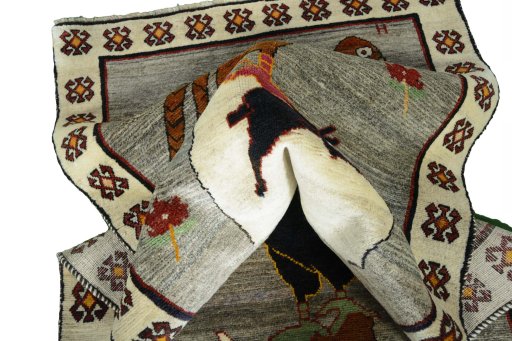Corner detail of 2000s Persian Gabbeh rug showing border pattern and Wool pile