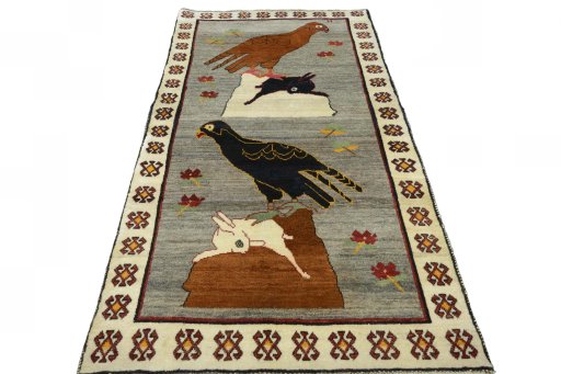 Surface texture of 2000s Persian Gabbeh rug with natural Wool and intricate pattern