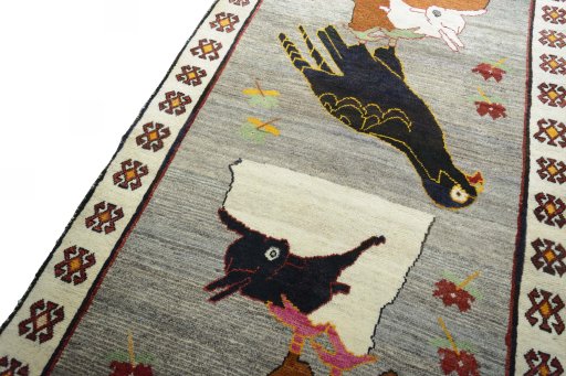 Backside of handmade 2000s Persian Gabbeh rug showing knot structure and weave density