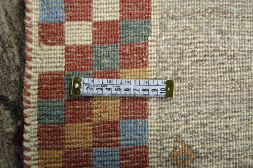 Corner detail of New Persian Gabbeh rug showing border pattern and Wool pile